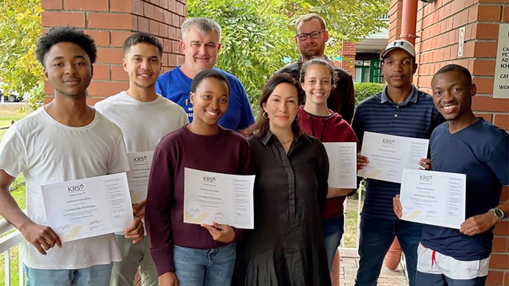 Proud KRS Internship Programme trainers pose with interns.